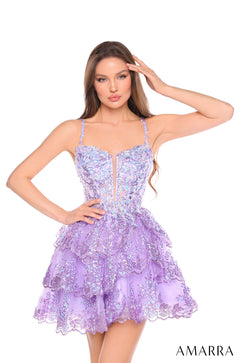 A model wears a shimmering lilac sequined party dress with a bustier top and tiered skirt by Amarra.