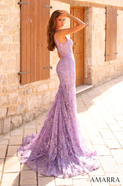 A lavender lace mermaid gown with a long train, worn against a stone wall with wooden shutters.
