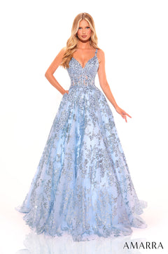 A model wears a light blue, floor-length ball gown with sparkling sequin embellishments and a sweetheart neckline.