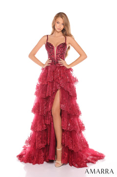 A model wears a deep red sequined gown with tiered ruffles and a high slit on a white background.