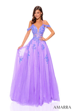 A purple ball gown with off-shoulder straps, floral embellishments, and a full tulle skirt on a model.
