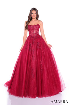 A strapless wine-colored ball gown with intricate floral lace and a full, flowing tulle skirt.