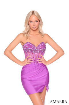 A woman wears a strapless, jewel-encrusted magenta cocktail dress with a fitted bodice and side slit.