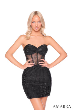 A blonde model wears a black rhinestone-embellished strapless corset mini dress with a sheer bustier design.