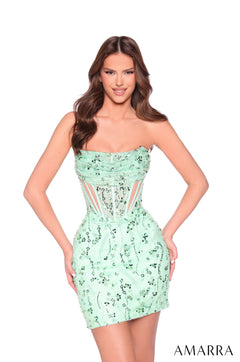 A woman wears a strapless Apple Green sequined cocktail dress with corset-style bodice and fitted silhouette.