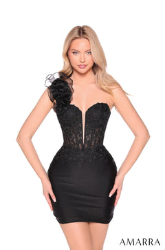 A woman models a form-fitting black cocktail dress with a sweetheart neckline and floral embellishments.