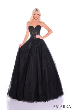 A model wears a black strapless ball gown with a lace corset bodice and full tulle skirt by Amarra.