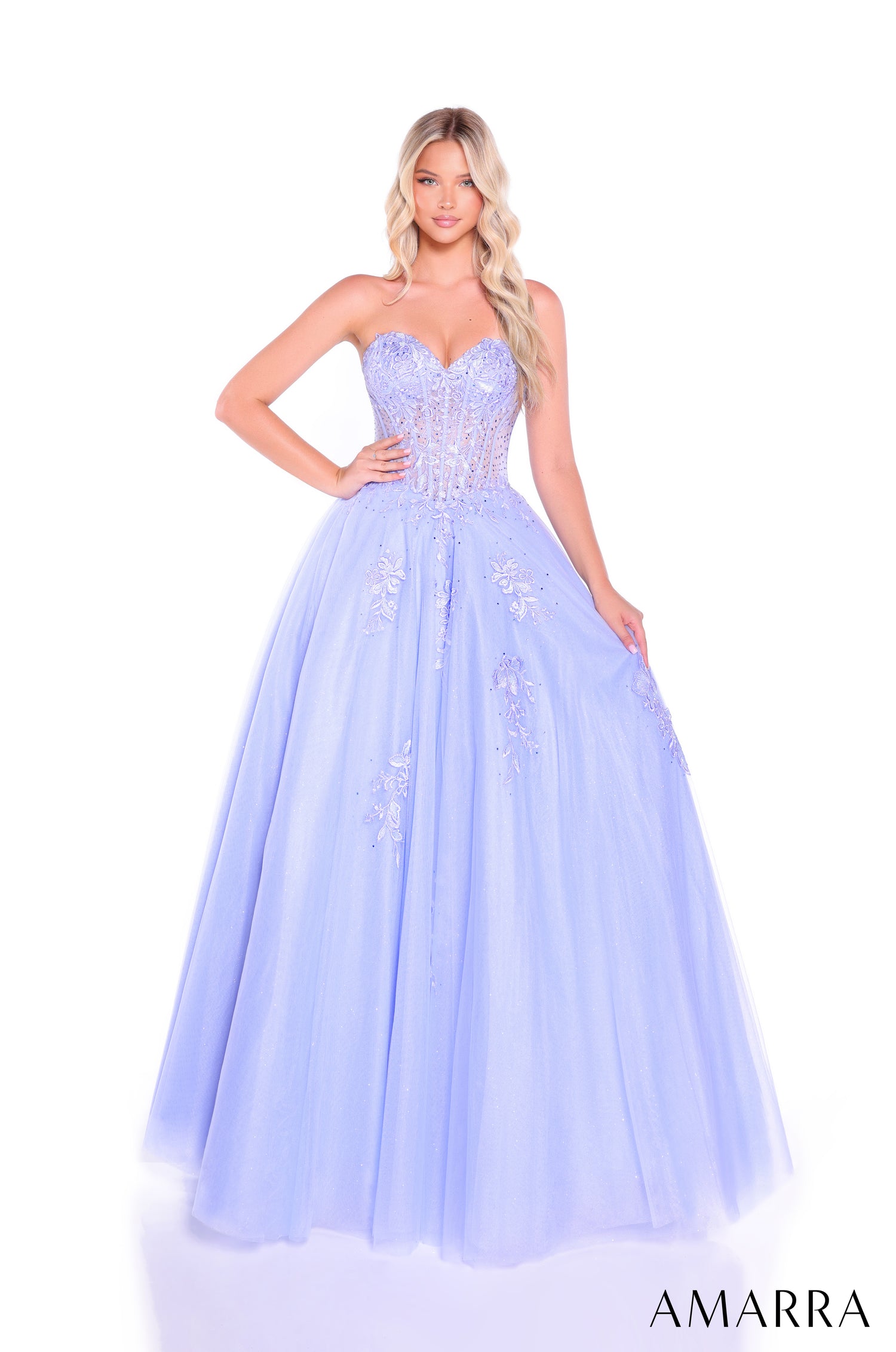 A lavender ball gown with a shimmering corset bodice and full tulle skirt, styled on a model against a white background.