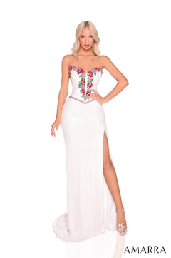 A strapless Ivory/Multi gown with floral embroidery, high slit, and a fitted silhouette worn by a blonde model.