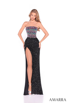 A model wears a strapless Black/Multi sequin gown with a colorful bodice and a high side slit.