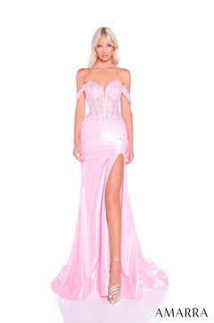 A model wears a strapless, light pink evening gown with a thigh-high slit and shimmering bodice.