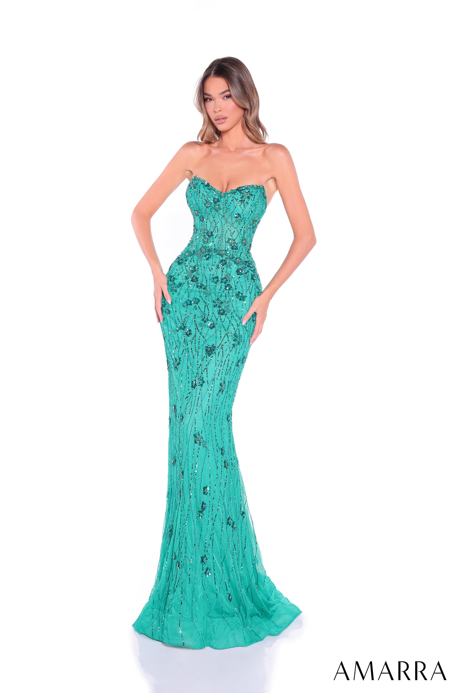 A strapless, form-fitting jade evening gown with intricate beaded and sequined embellishments from Amarra.