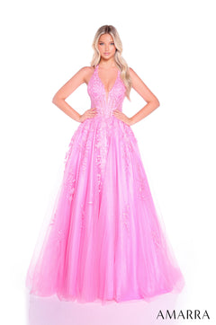 A model wears a full-length Bright Pink ball gown with lace appliqués and a plunging V-neckline.