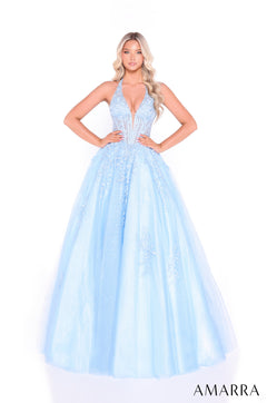 A woman wears a light blue plunging halter ballgown with floral lace appliqués and a full tulle skirt.