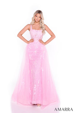 A model wears a fitted Light Pink sequin gown with a flowing tulle overskirt and square neckline.