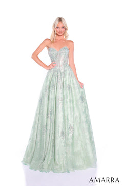 A strapless sage ballgown with a corset bodice and sparkly tulle skirt stands on a white background.