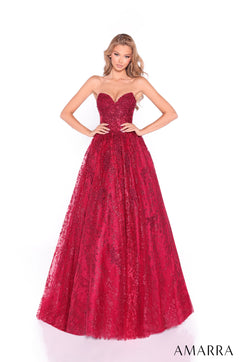 A strapless, full-length ball gown in wine-colored lace with a fitted bodice and voluminous sparkly skirt.