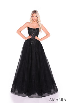 A model wears a strapless, floor-length Black ball gown with intricate beaded bodice and full tulle skirt.