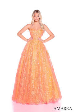 A model wears a strapless, full-length Neon Orange ballgown with shimmering floral embellishments.