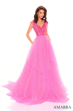 A floor-length ballgown features a beaded bodice and voluminous neon pink tulle skirt.