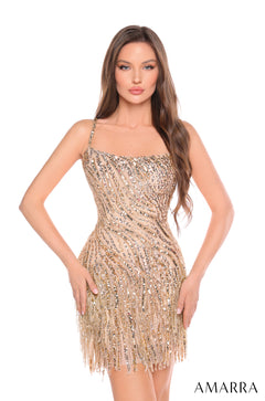 A woman wears a fitted, gold sequined cocktail dress with fringe hem from Amarra's collection.