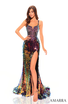 A model wears a sparkling Purple/Multi sequin gown with a high slit and intricate fringe details.
