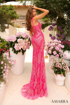 A hot pink sequined mermaid gown with a long train, posed among pink and purple flowers in a garden setting.