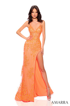 A slender model wears a long, sequined Neon Orange gown with a high slit and floral embroidery.