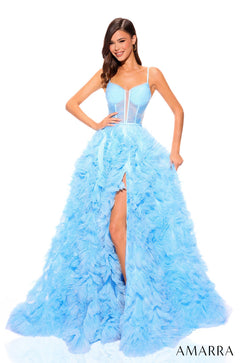 A model wears a Light Blue/Multi ruffled ball gown with a corset top and high side slit.