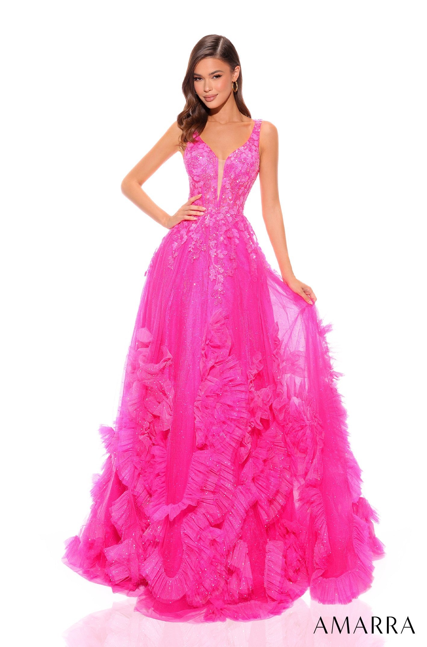 A hot pink ballgown with a plunging neckline, floral appliqués, and a ruffled tulle skirt.