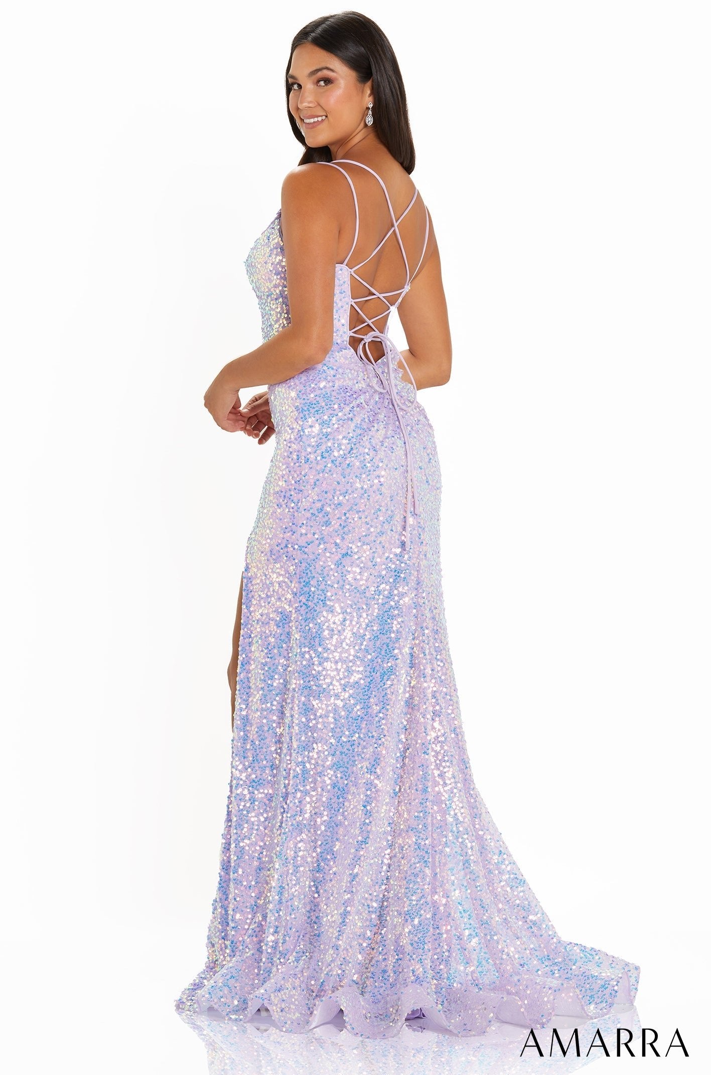 A glittery lavender sequin gown with a lace-up back and high slit, showcased on a model from Amarra.