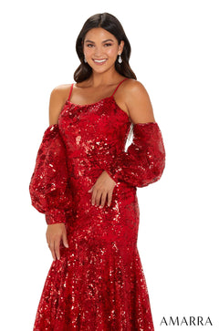A woman in a red sequined off-shoulder gown smiles confidently against a white background.