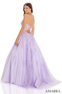 A woman wears a lavender ballgown with floral embroidery and an open lace-up back.