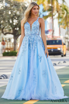 A pale blue ballgown with delicate floral embroidery and a deep V-neckline, worn on a city street.