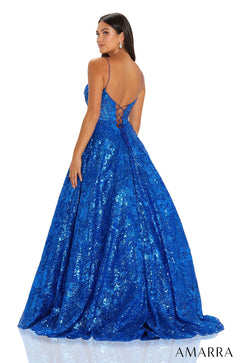 A royal blue sequined ball gown with a sweetheart neckline and corset-style back, photographed from behind.