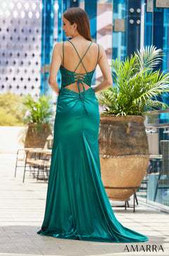 A teal satin evening gown with a corset back and lace details, photographed from behind on a model.