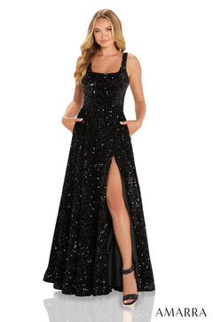 A model wears a sparkling black sequin gown with a high slit and square neckline.