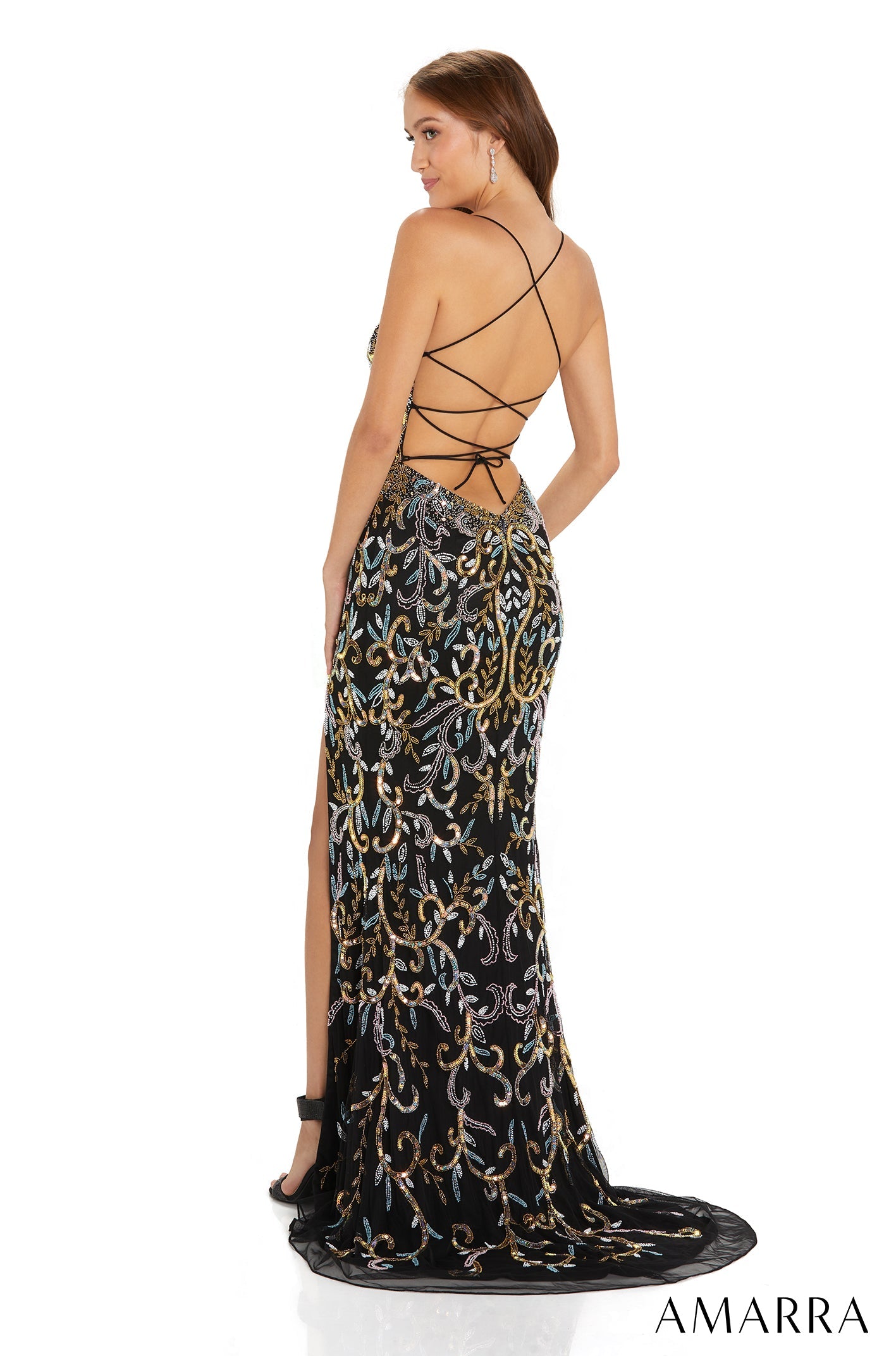 Black gown with metallic embroidery features strappy back and high leg slit from Amarra.