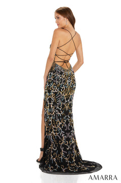 Black gown with metallic embroidery features strappy back and high leg slit from Amarra.