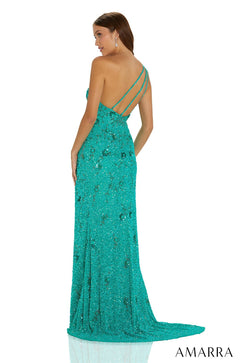 A teal sequined one-shoulder gown with a train, worn by a model facing away from the camera.